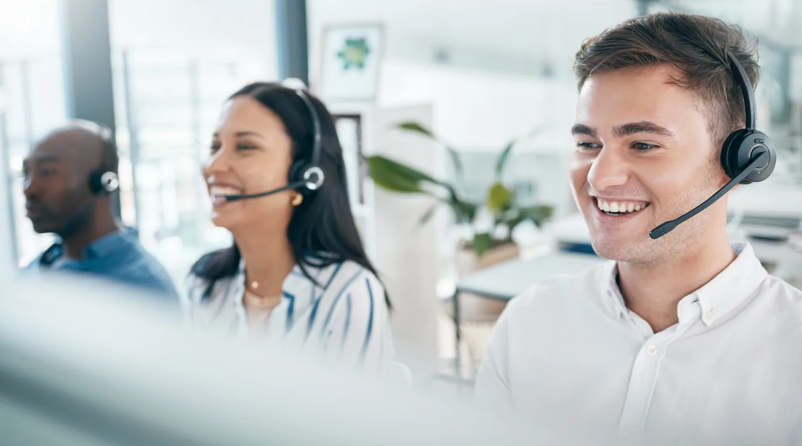 Call center, customer service and happy team for support, crm and telemarketing in office. Men and